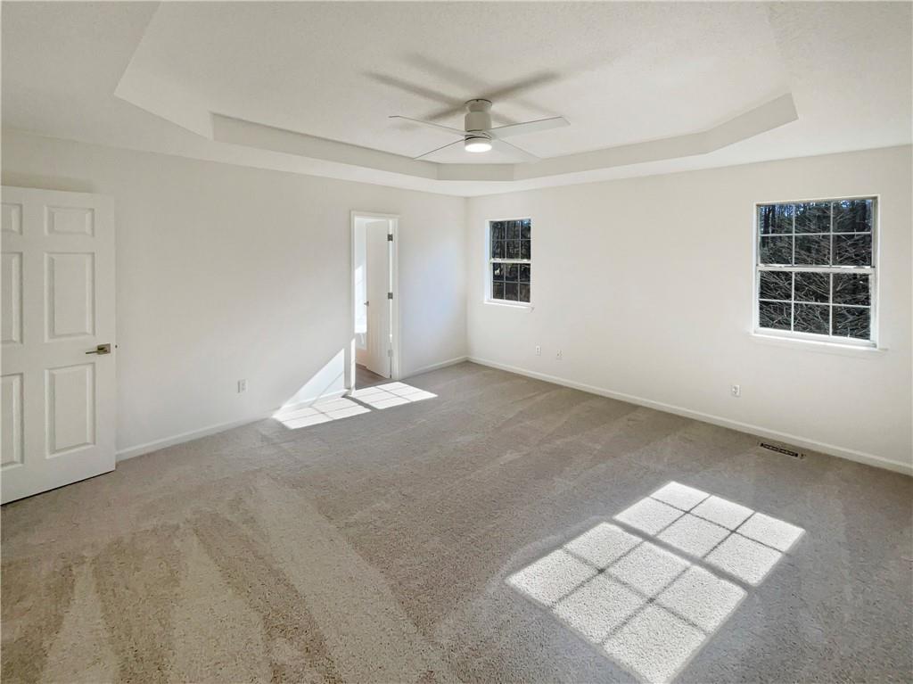 180 Honeysuckle Drive Southeast Calhoun, GA 30701 - Photo 10 of 21 an empty room with windows