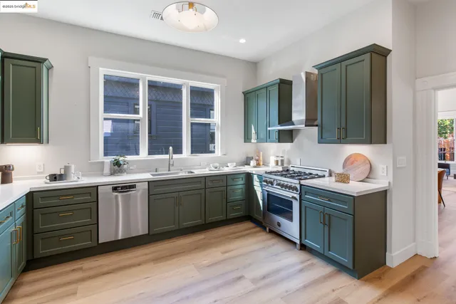 a kitchen with granite countertop a stove and a sink