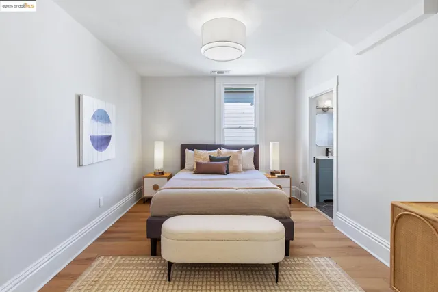 a bedroom with a bed and couch