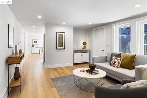 a living room with furniture and a rug