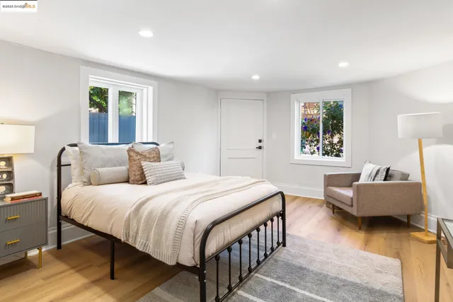 a workspace with furniture window and wooden floor