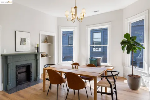 a view of a dining room with furniture window and wooden floor