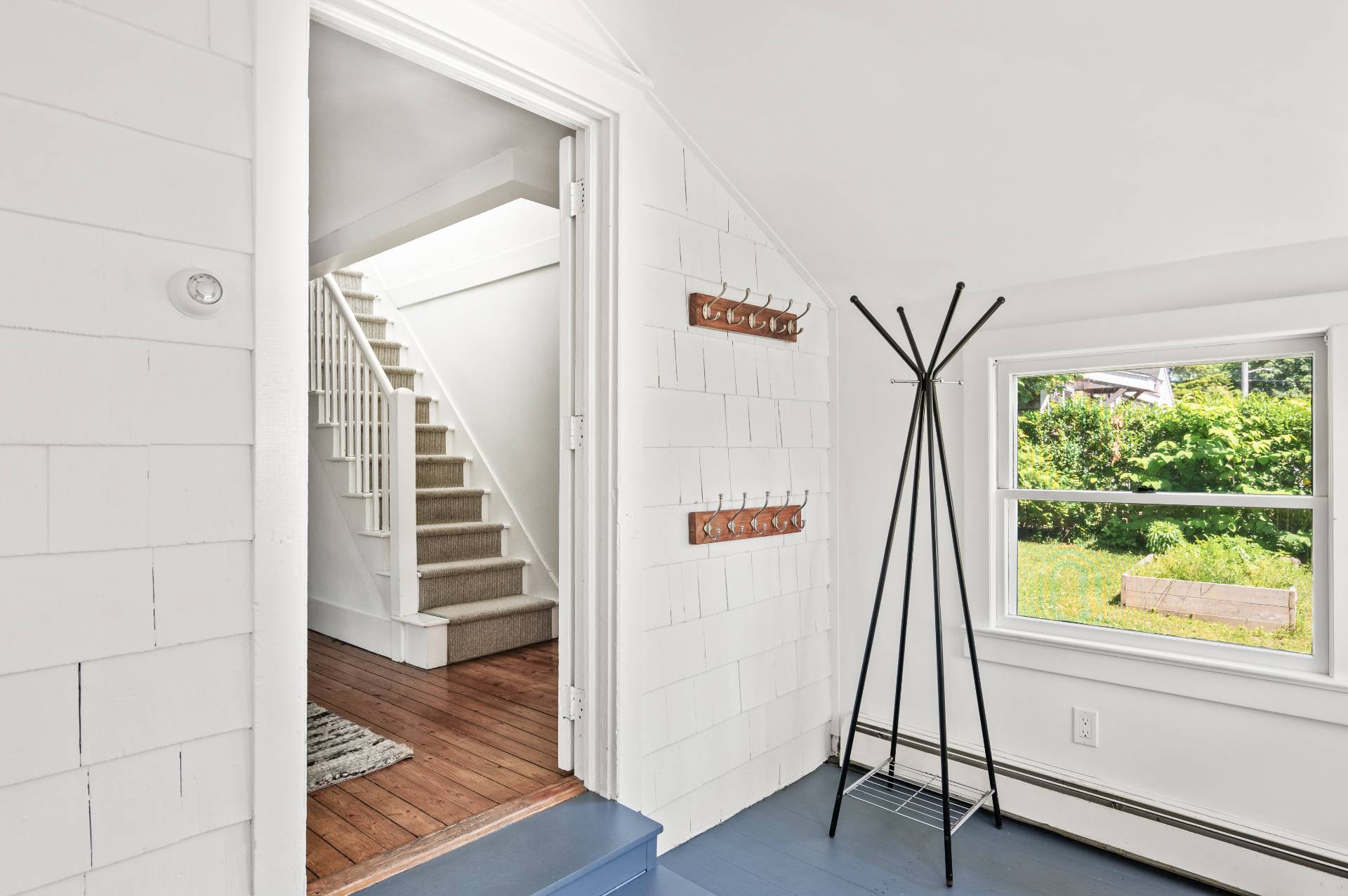 8 Collins Avenue East Hampton, NY 11937 - Photo 11 of 33 a view of a hallway with wooden floor and entryway