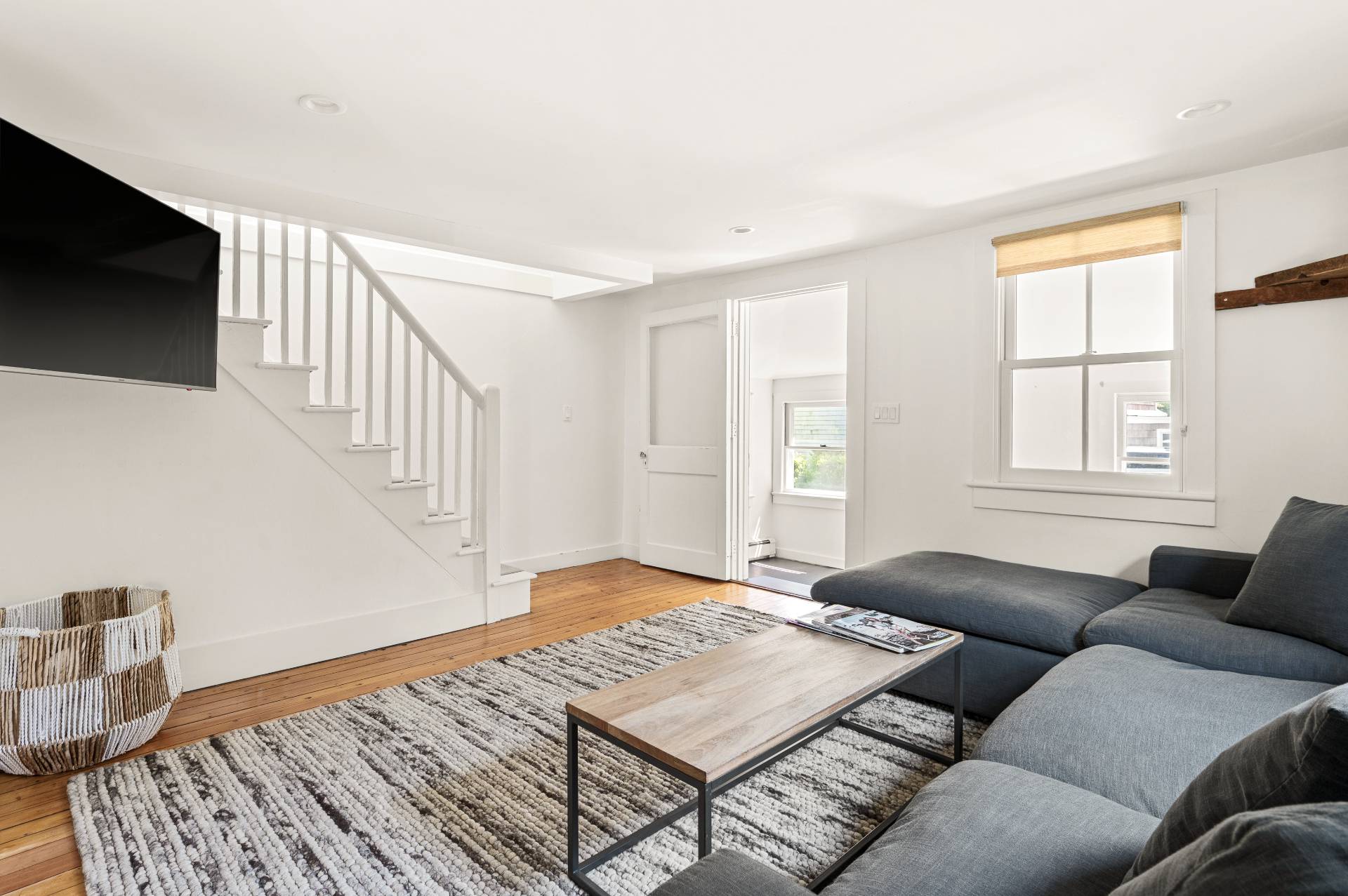 8 Collins Avenue East Hampton, NY 11937 - Photo 12 of 33 a living room with furniture and a flat screen tv