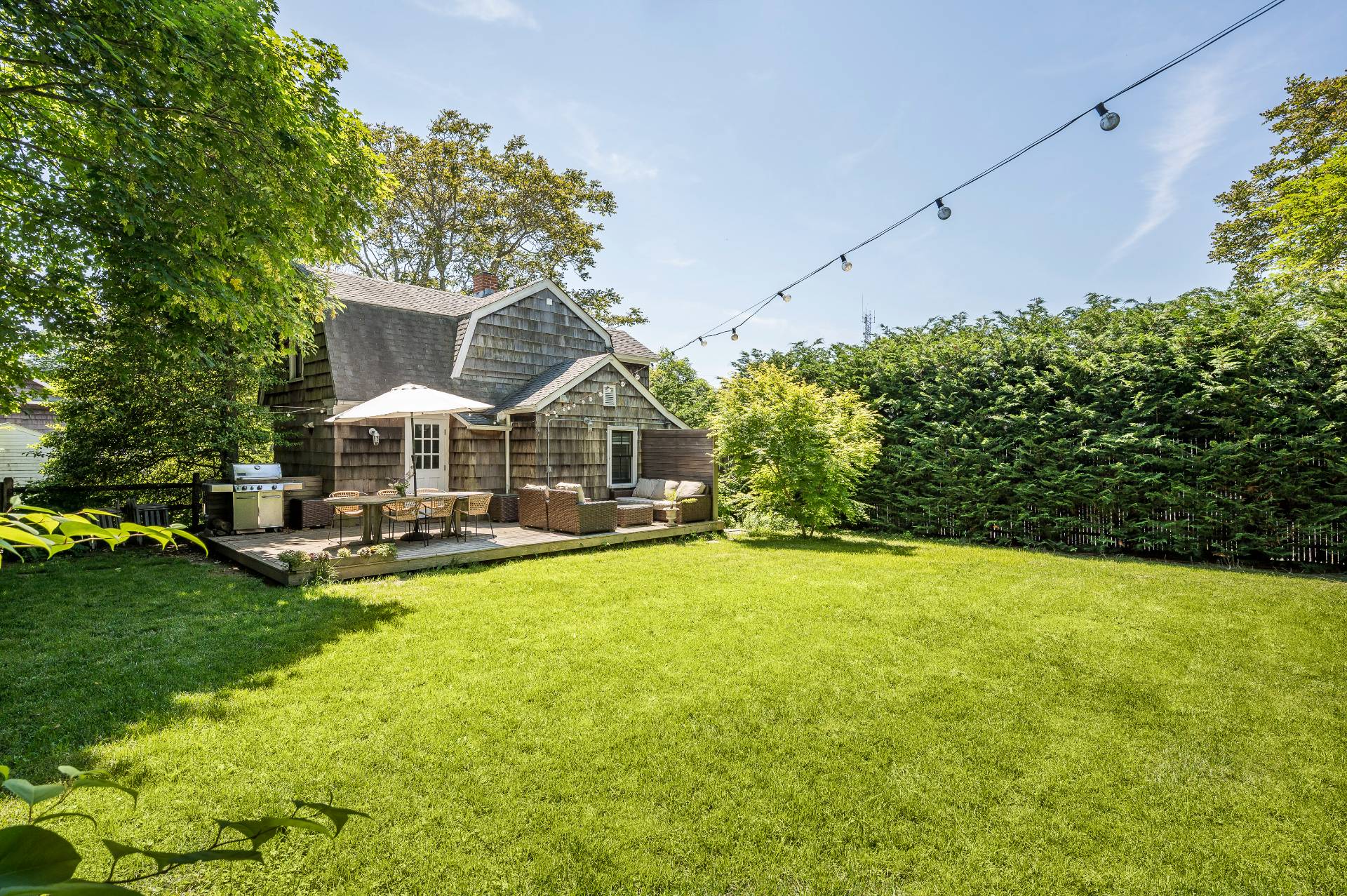 8 Collins Avenue East Hampton, NY 11937 - Photo 13 of 33 a view of a house with swimming pool and sitting area
