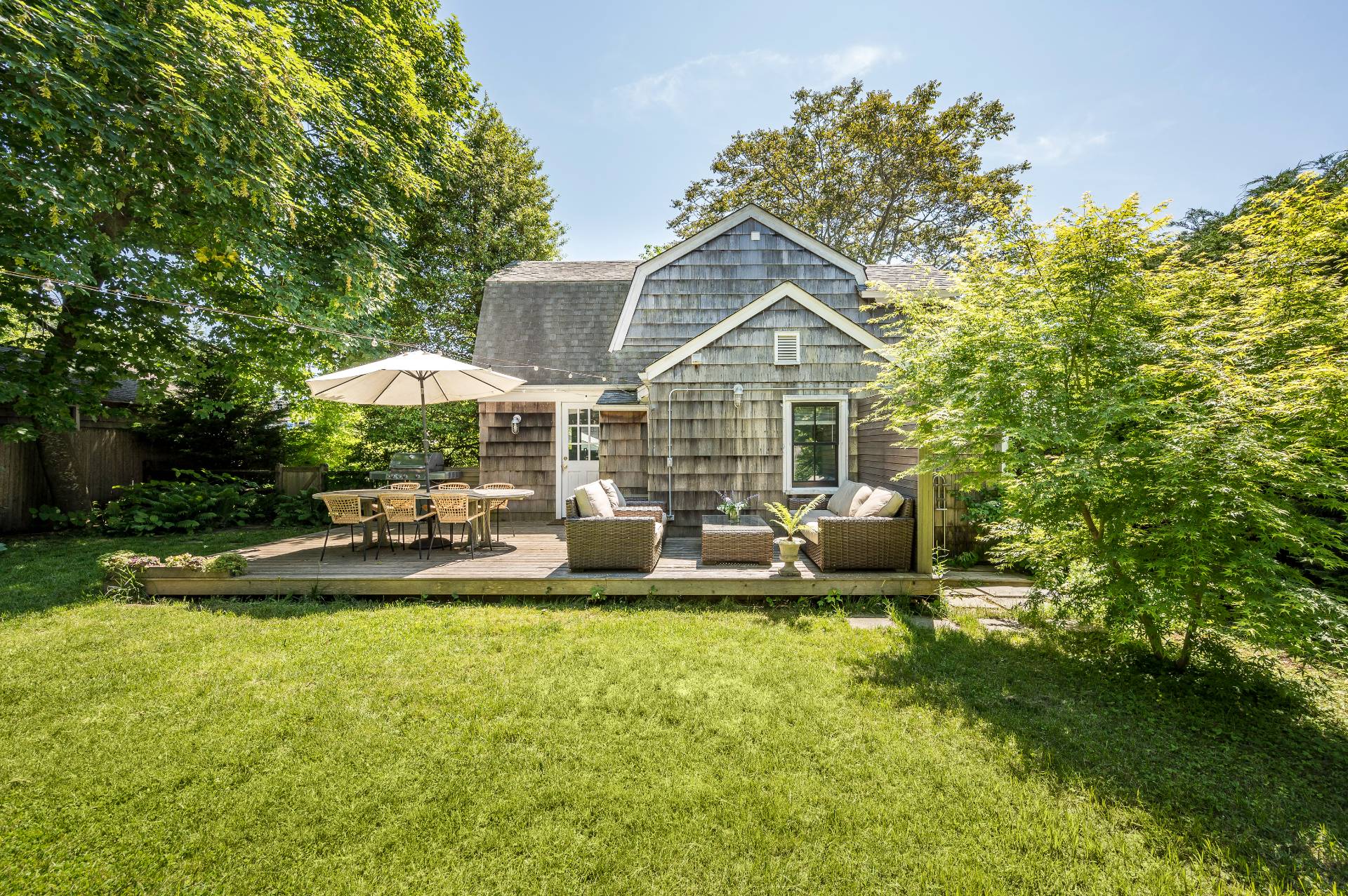 8 Collins Avenue East Hampton, NY 11937 - Photo 14 of 33 a view of a house with backyard porch and sitting area