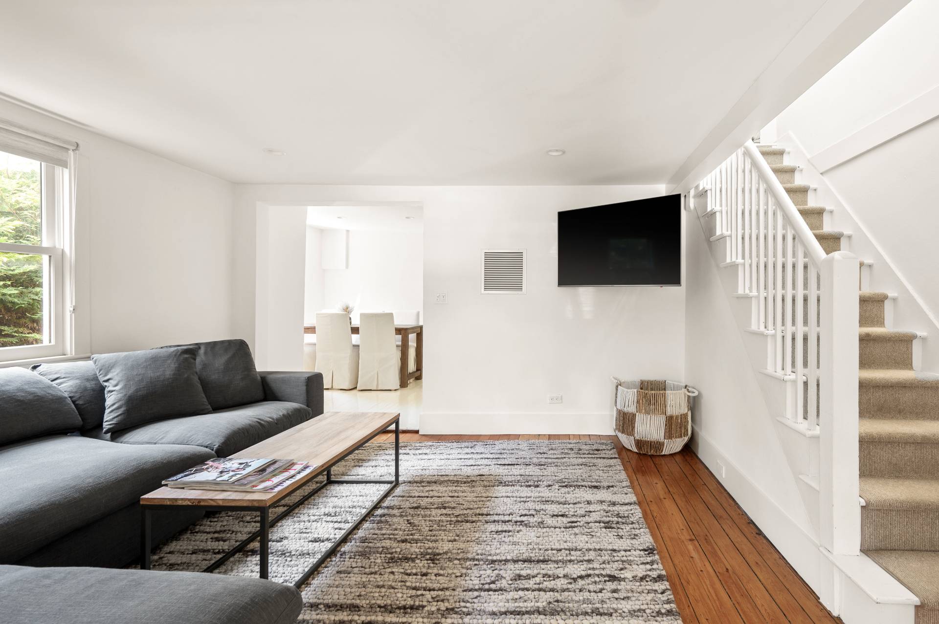 8 Collins Avenue East Hampton, NY 11937 - Photo 23 of 33 a living room with furniture and a flat screen tv