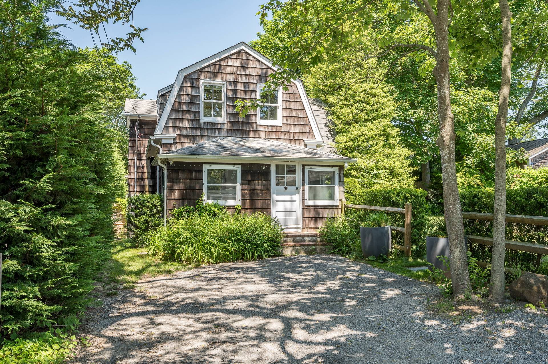 8 Collins Avenue East Hampton, NY 11937 - Photo 24 of 33 a front view of a house with garden