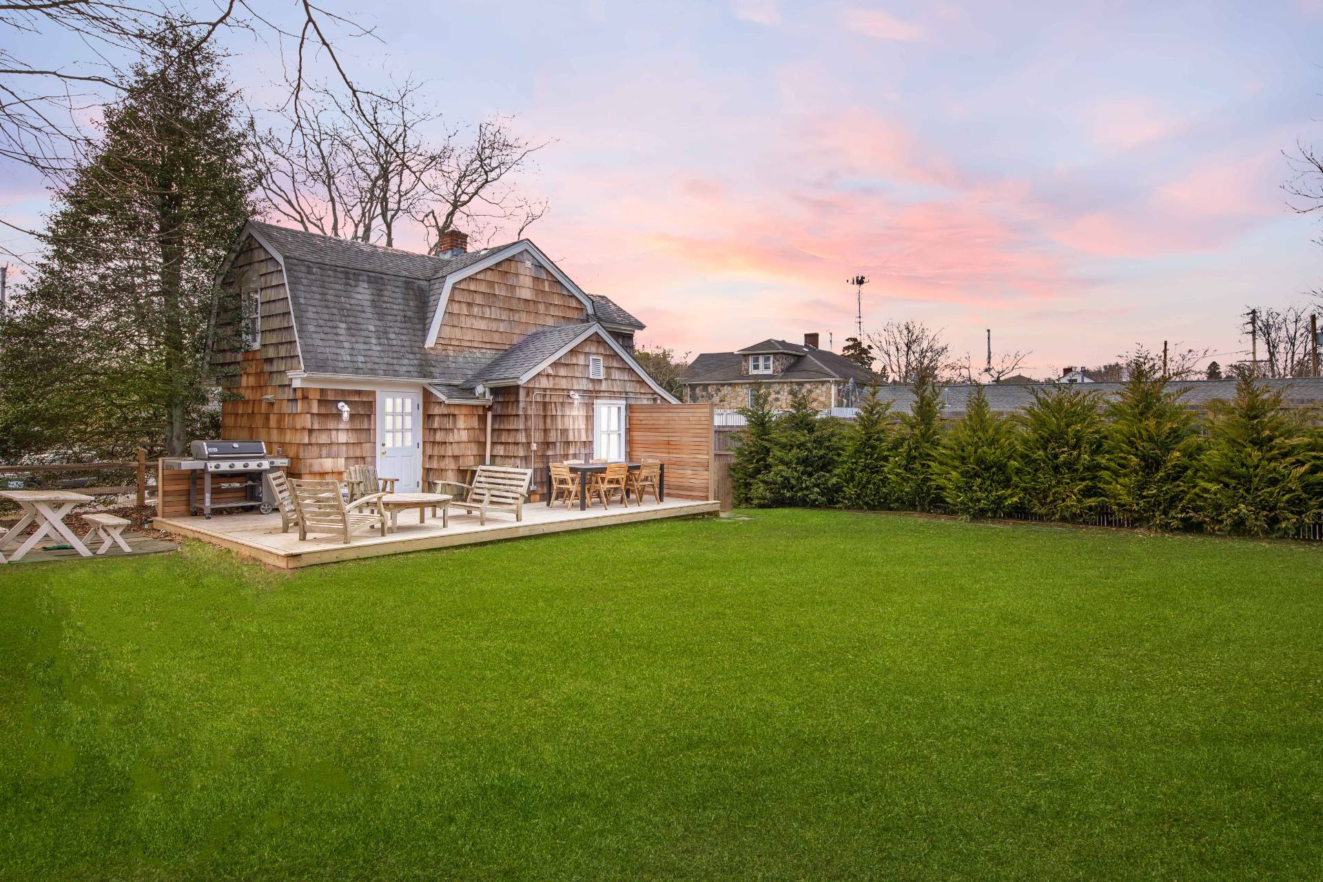 8 Collins Avenue East Hampton, NY 11937 - Photo 27 of 33 a view of a house with a yard and sitting area