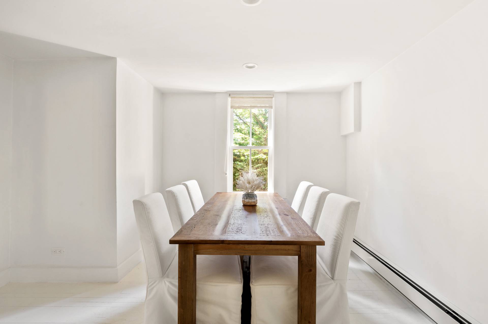 8 Collins Avenue East Hampton, NY 11937 - Photo 31 of 33 a view of a dining room with a table and chairs
