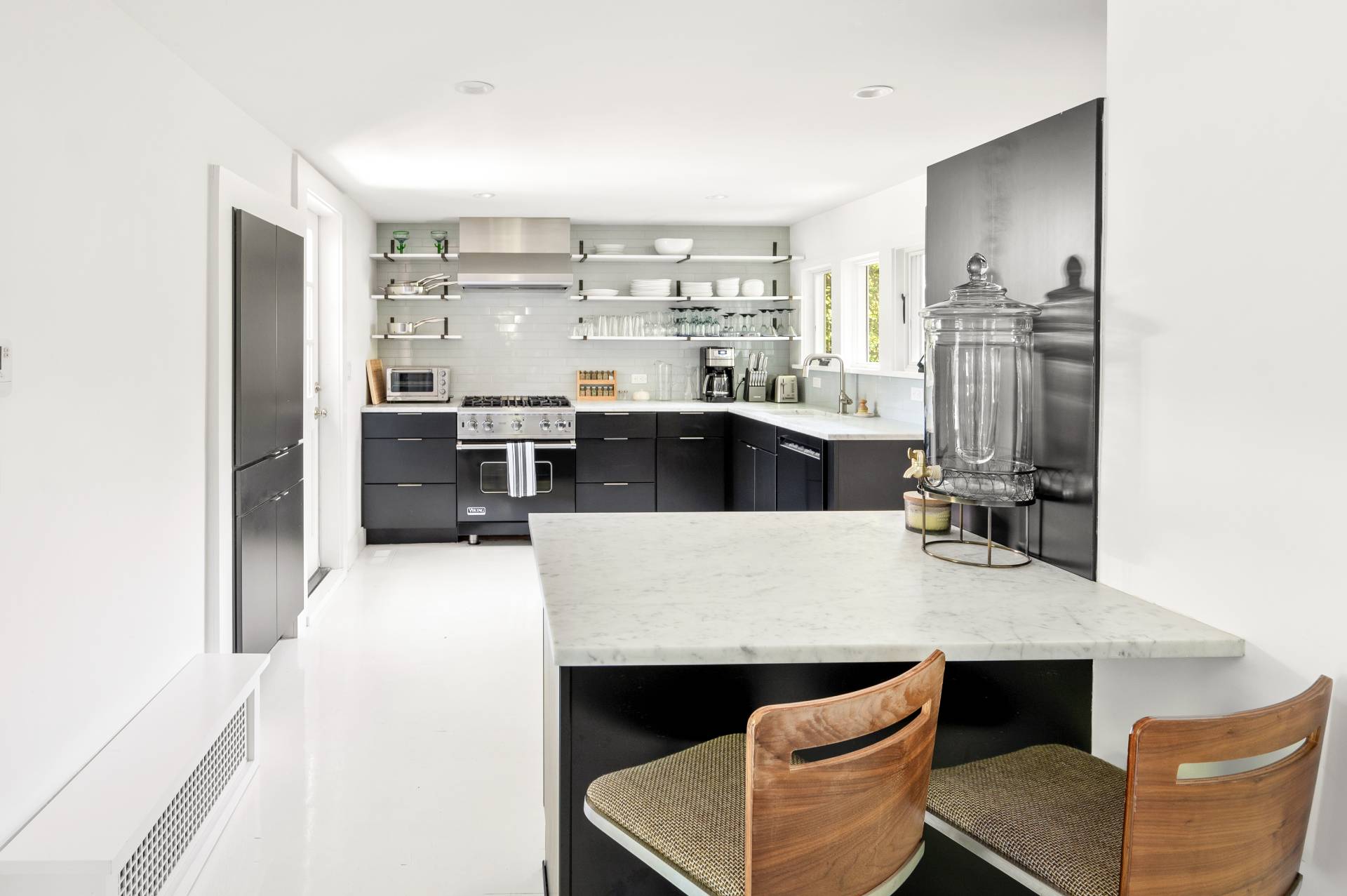 8 Collins Avenue East Hampton, NY 11937 - Photo 32 of 33 a large kitchen with kitchen island a large counter top space appliances and cabinets