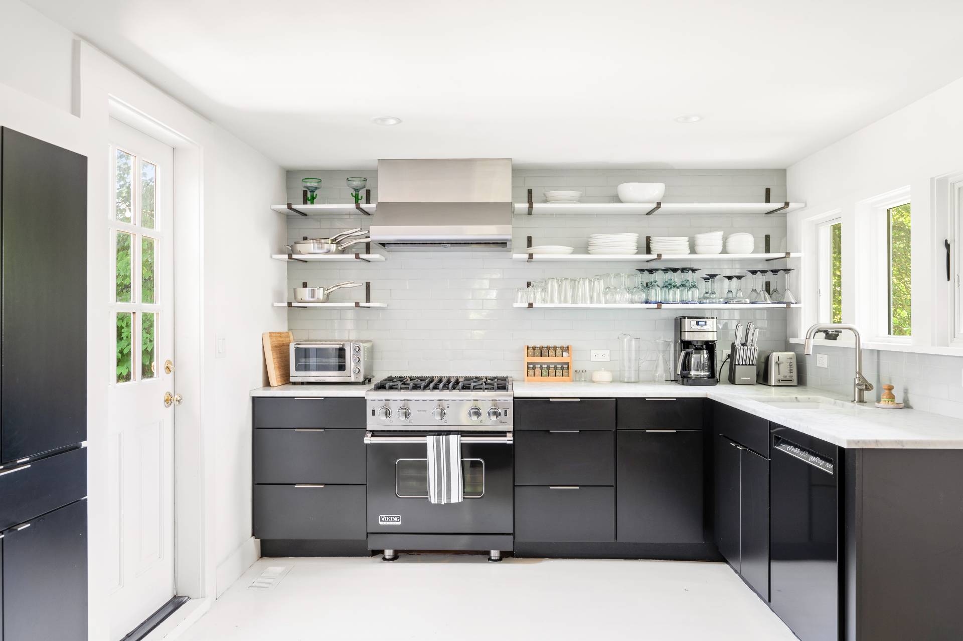 8 Collins Avenue East Hampton, NY 11937 - Photo 33 of 33 a kitchen with stainless steel appliances granite countertop a stove a sink and a refrigerator