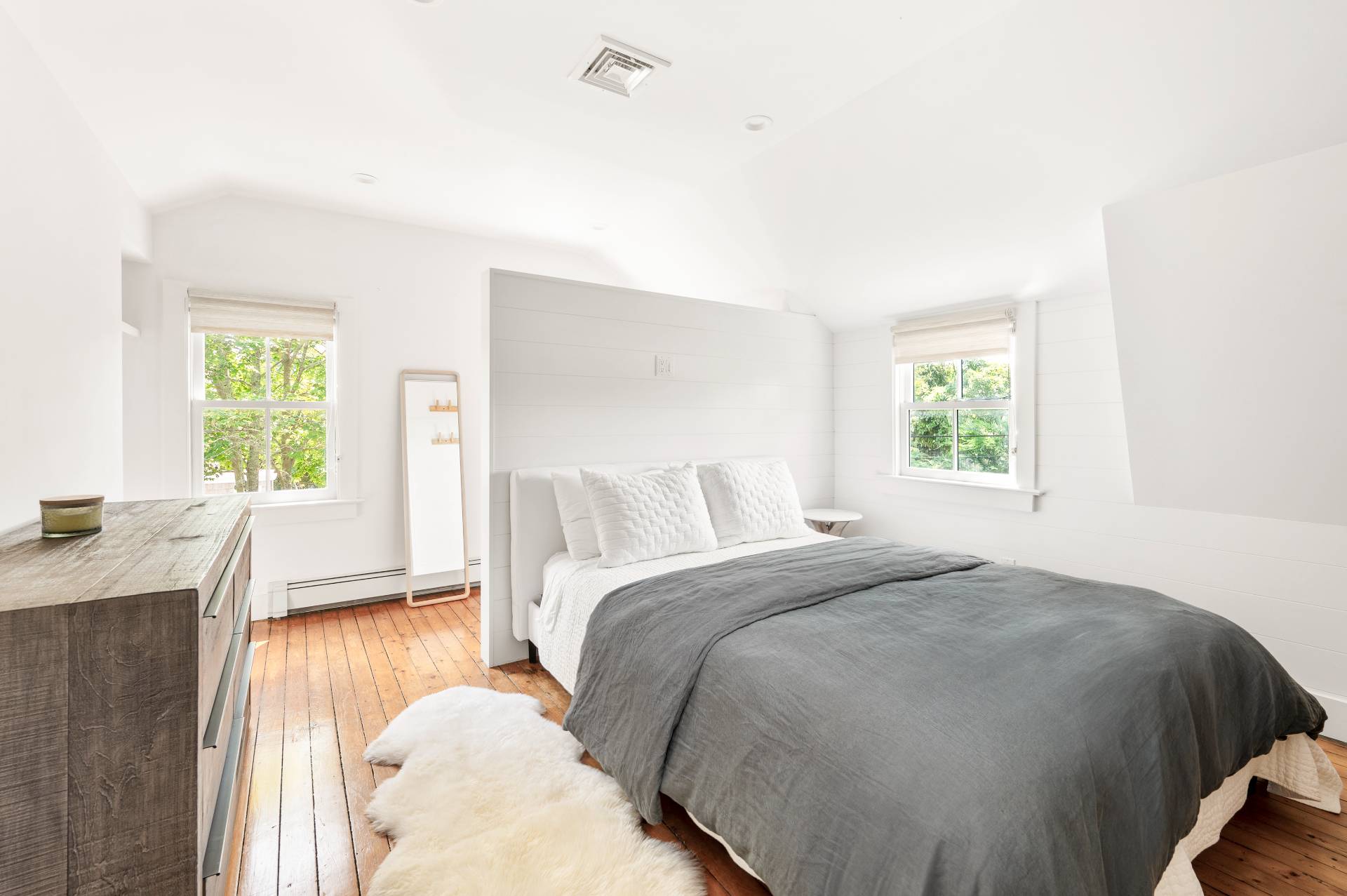 8 Collins Avenue East Hampton, NY 11937 - Photo 4 of 33 a bedroom with a bed and a window