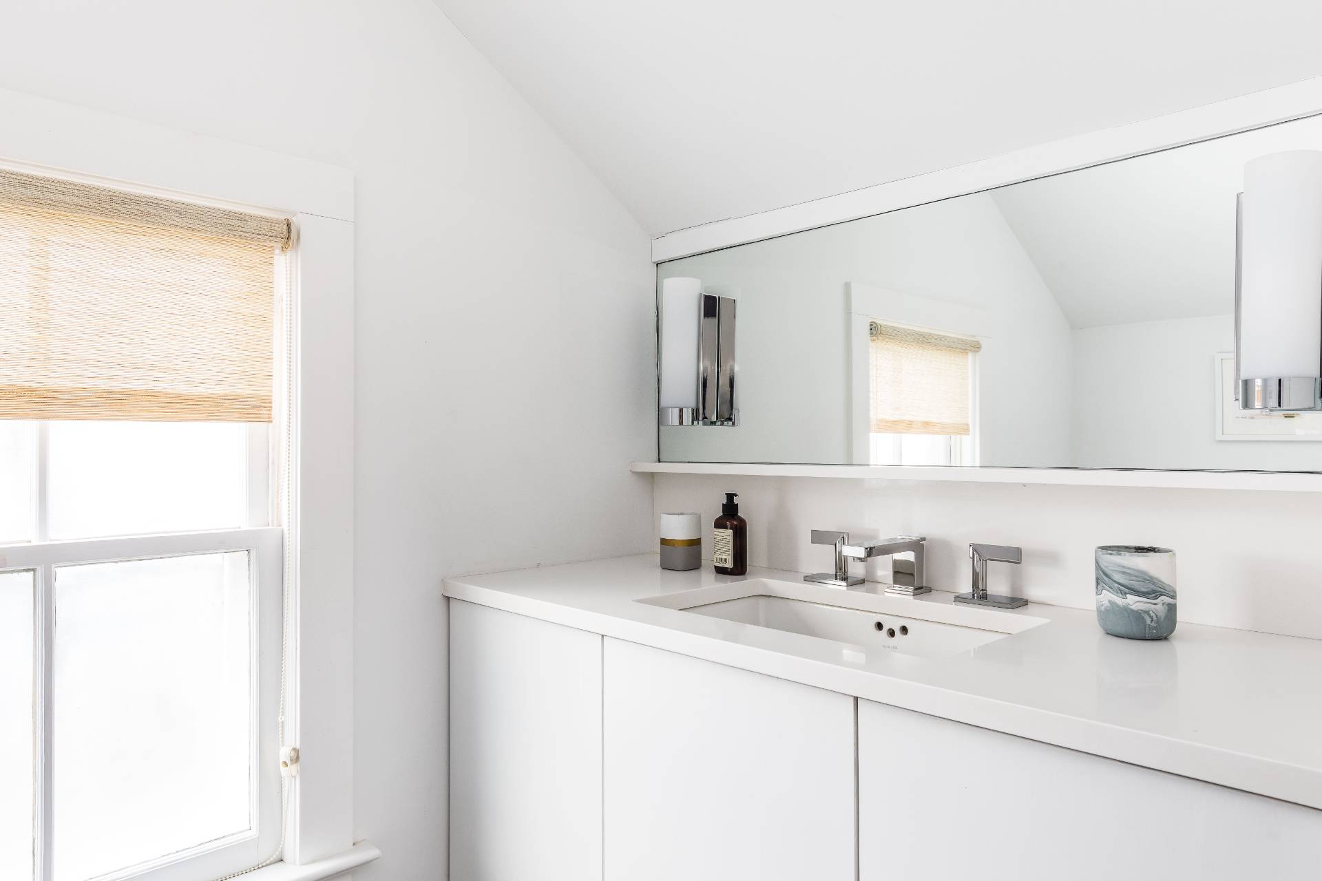 8 Collins Avenue East Hampton, NY 11937 - Photo 8 of 33 a bathroom with a sink and a mirror
