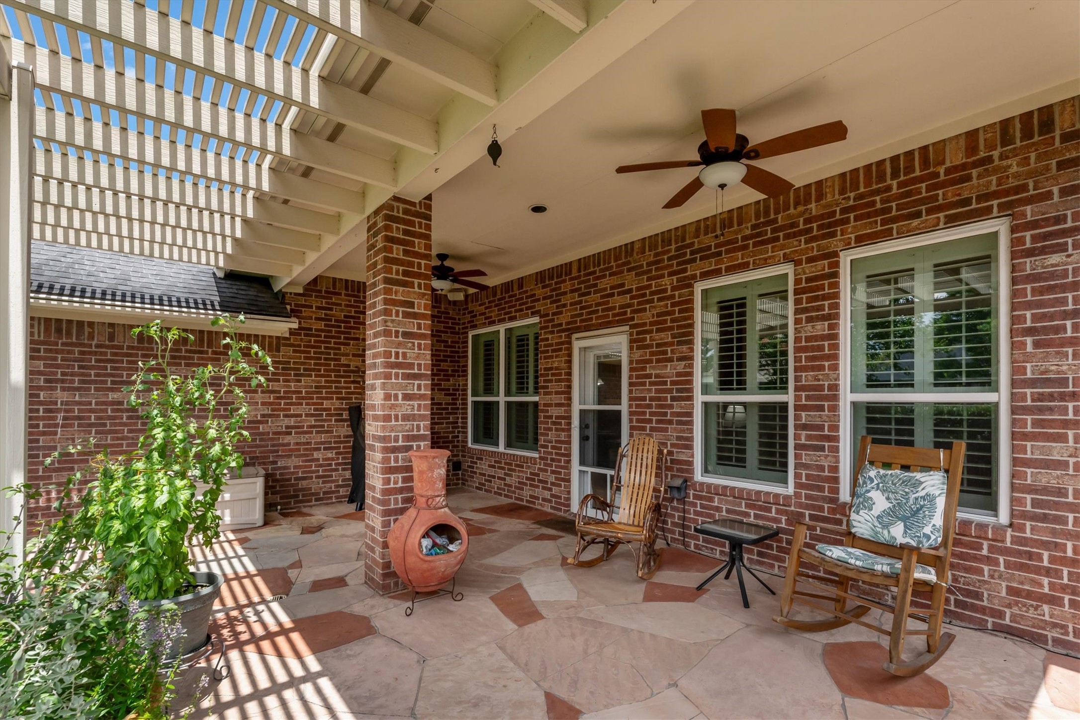 9406 Lochflora Drive Spring, TX 77379 - Photo 32 of 49 a view of a patio with table and chairs and potted plants