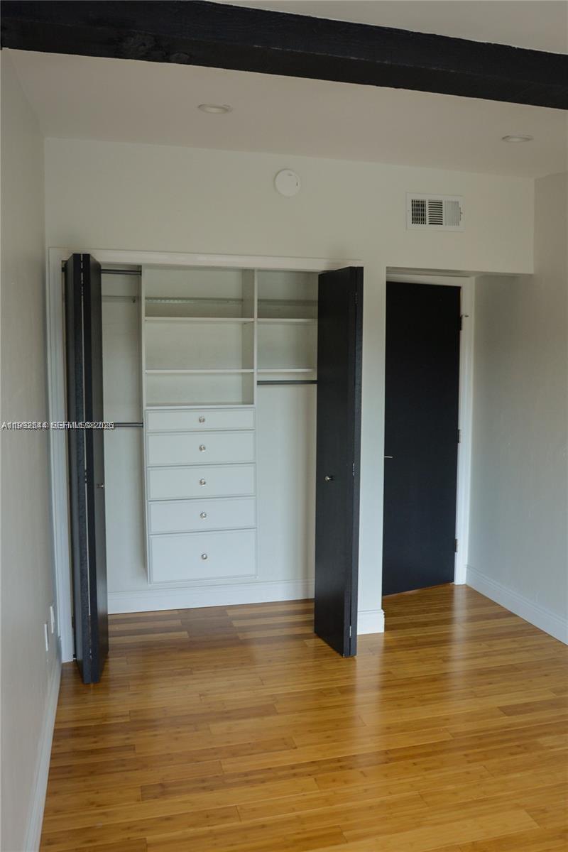 7849 Southwest 103rd Place Miami, FL 33173 - Photo 21 of 64 a view of walk in closet with empty room