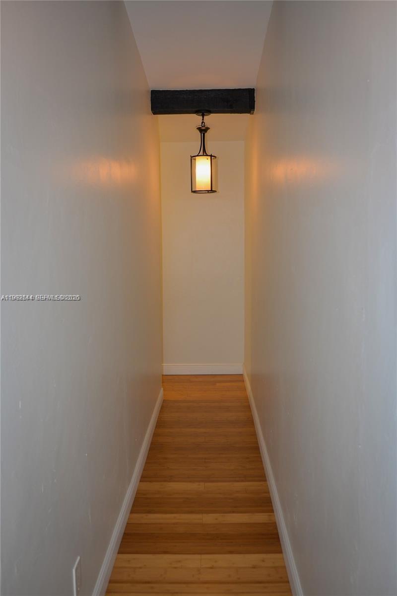 7849 Southwest 103rd Place Miami, FL 33173 - Photo 29 of 64 a view of a hallway with wooden floor