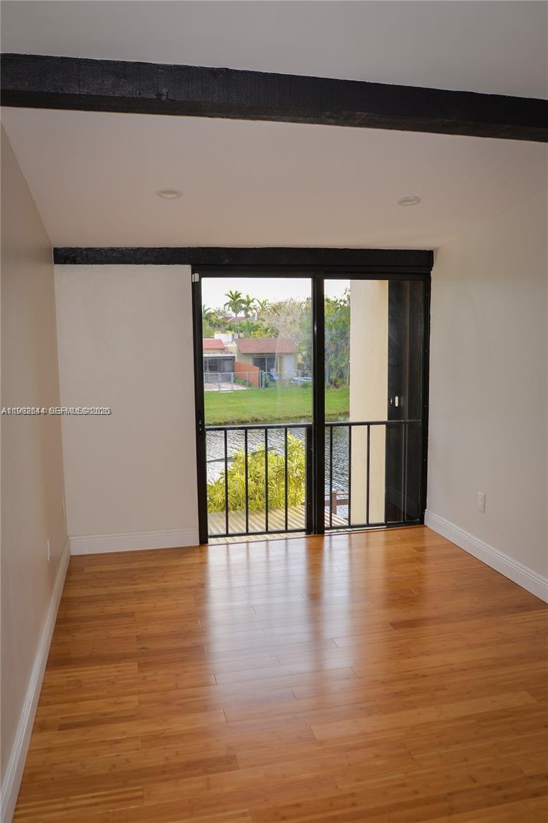 7849 Southwest 103rd Place Miami, FL 33173 - Photo 40 of 64 a view of an entryway with wooden floor