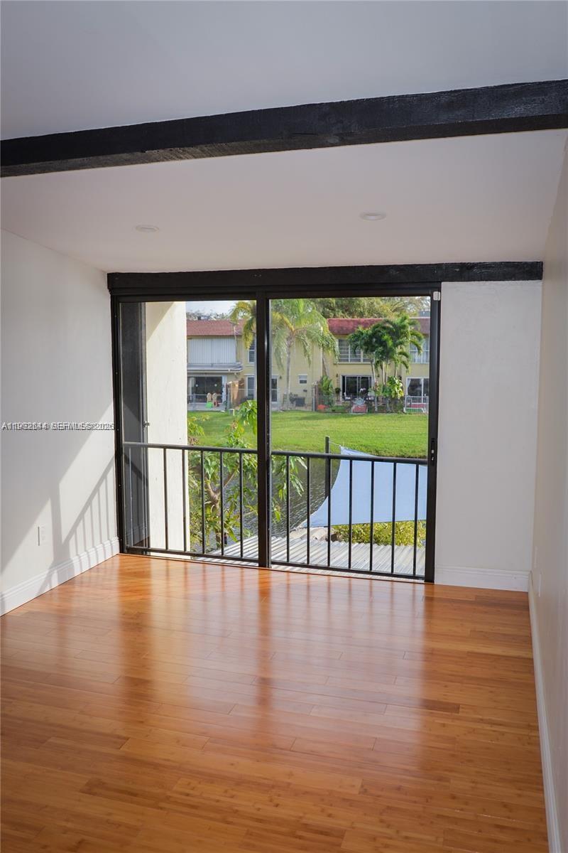7849 Southwest 103rd Place Miami, FL 33173 - Photo 43 of 64 a view of an entryway with wooden floor