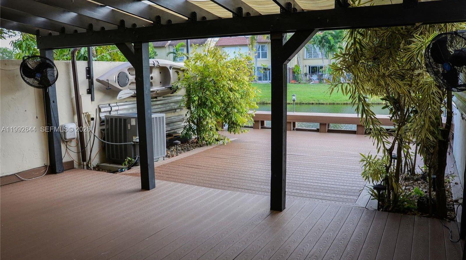 7849 Southwest 103rd Place Miami, FL 33173 - Photo 48 of 64 a view of a porch with wooden floor