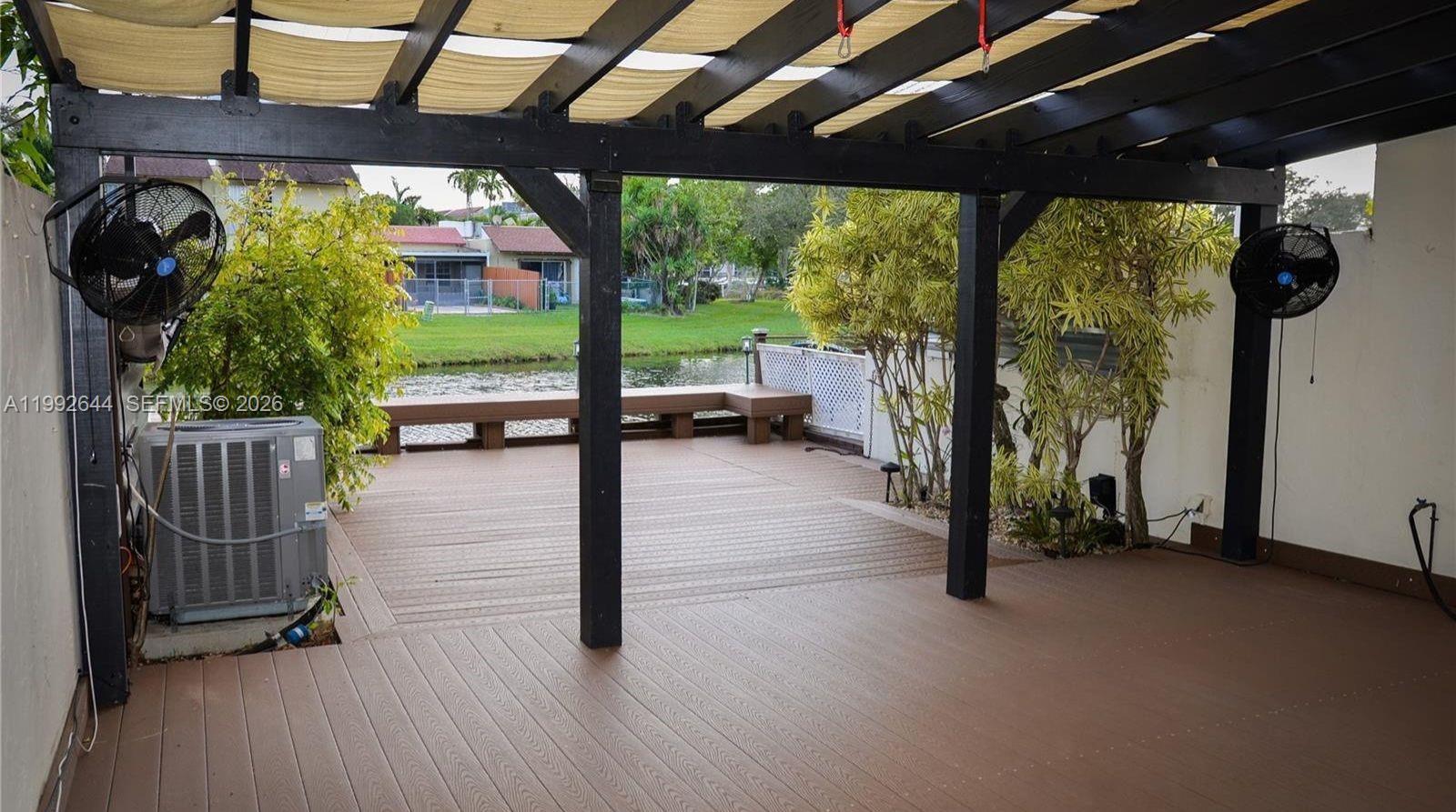 7849 Southwest 103rd Place Miami, FL 33173 - Photo 49 of 64 a view of a porch with wooden floor