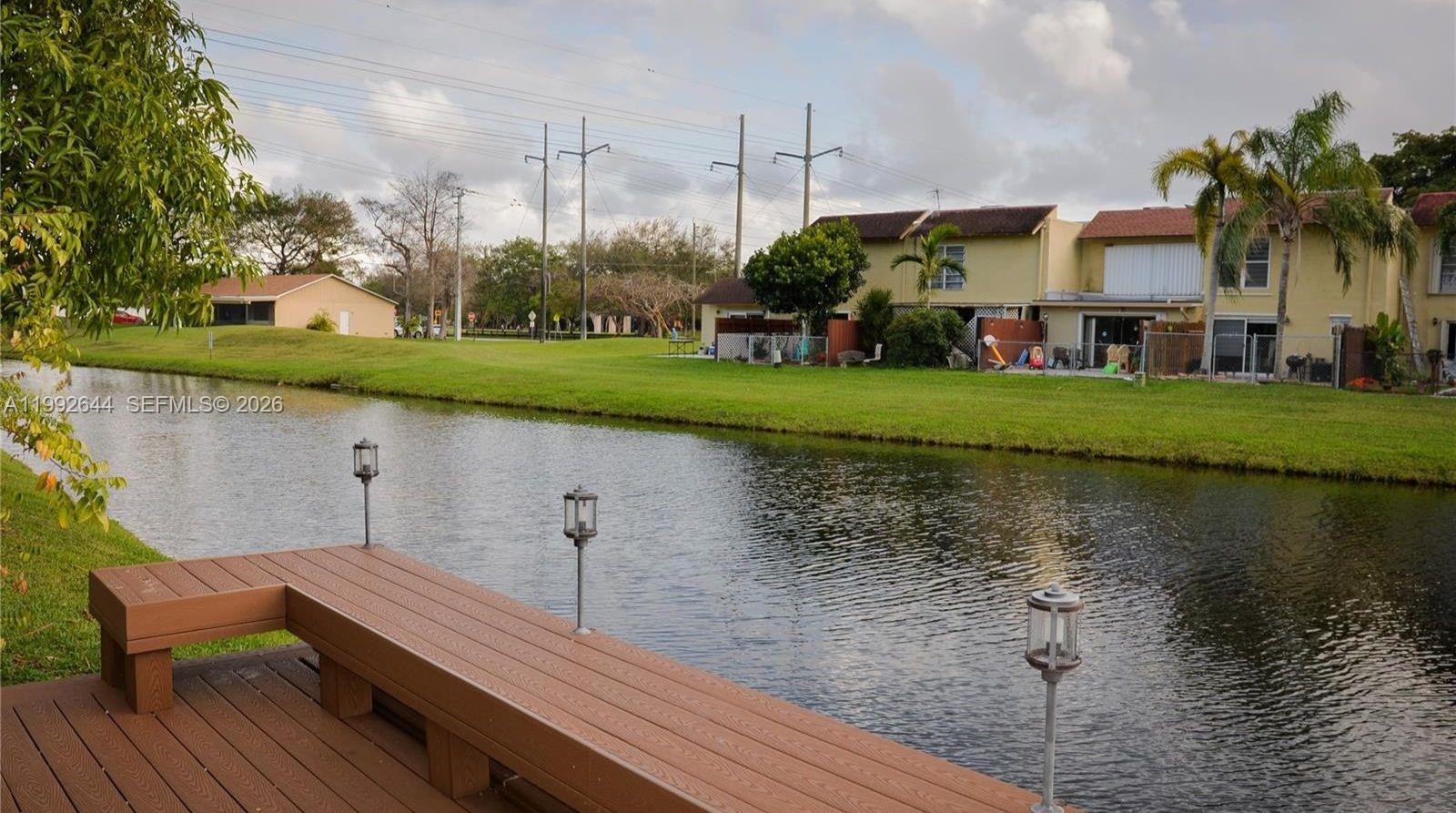 7849 Southwest 103rd Place Miami, FL 33173 - Photo 55 of 64 a view of a house with a yard and a lake view