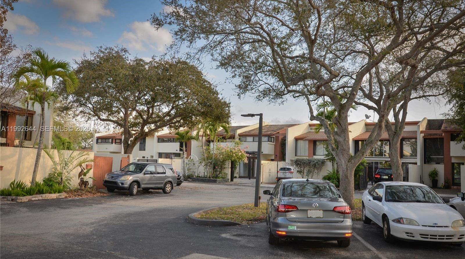 7849 Southwest 103rd Place Miami, FL 33173 - Photo 63 of 64 a car parked on the side of a street