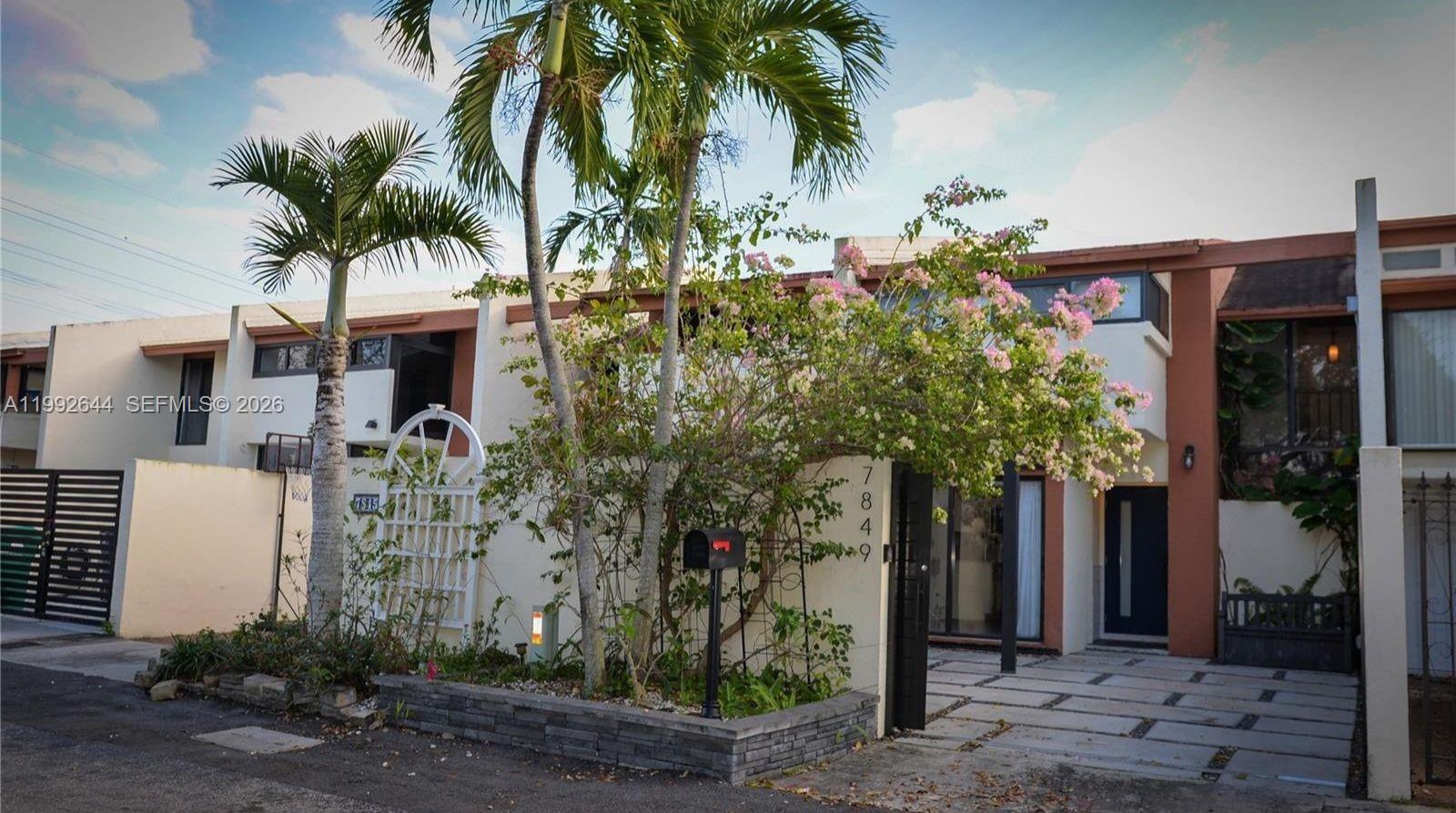 7849 Southwest 103rd Place Miami, FL 33173 - Photo 64 of 64 front view of a house with a tree