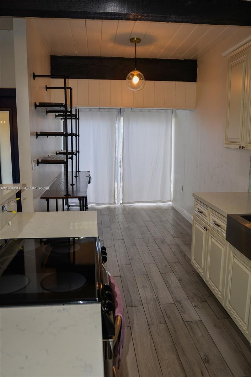 7849 Southwest 103rd Place Miami, FL 33173 - Photo 9 of 64 a kitchen with stainless steel appliances a sink and cabinets