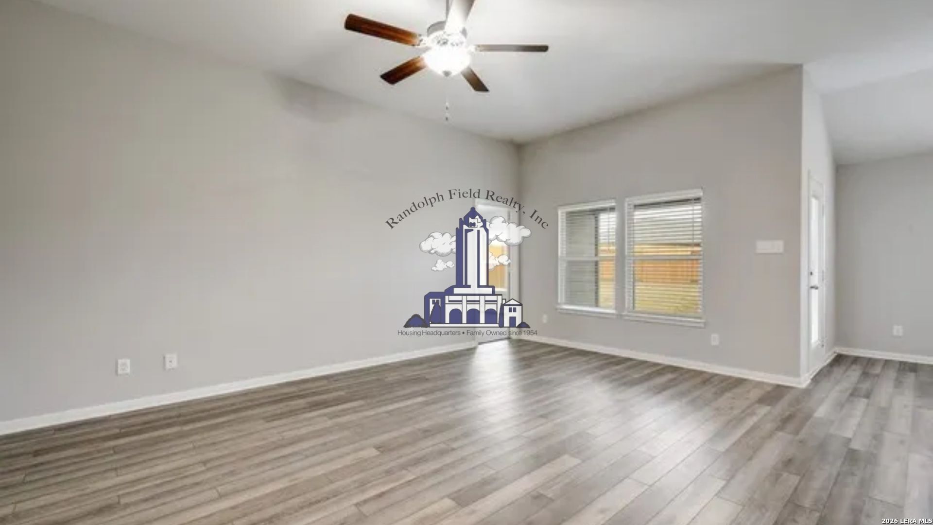 9330 Bennett Forest Converse, TX 78109 - Photo 5 of 20 wooden floor in an empty room with a window