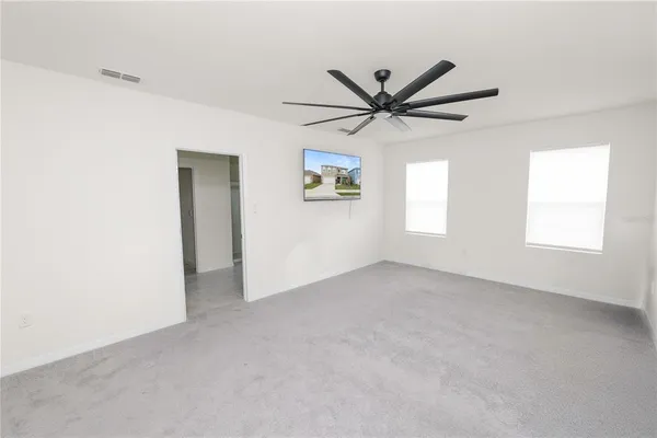a bathroom with a granite countertop sink and mirror