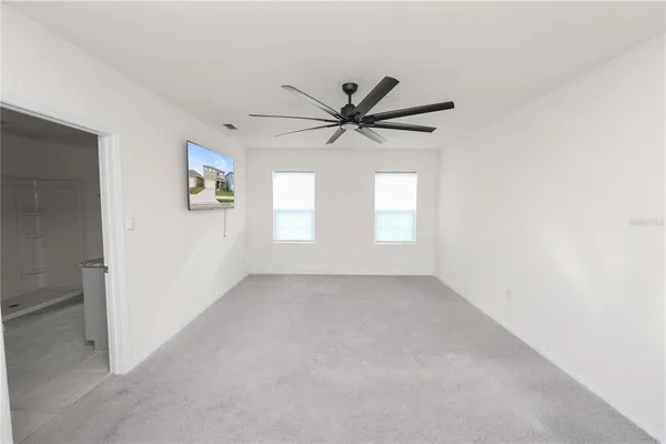 a bathroom with granite countertop a sink and a vanity
