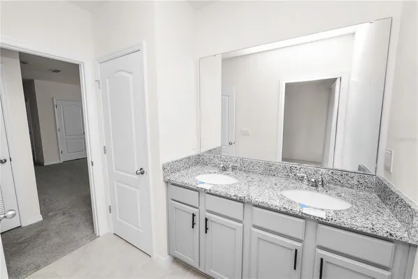 a view of oven and wooden floor