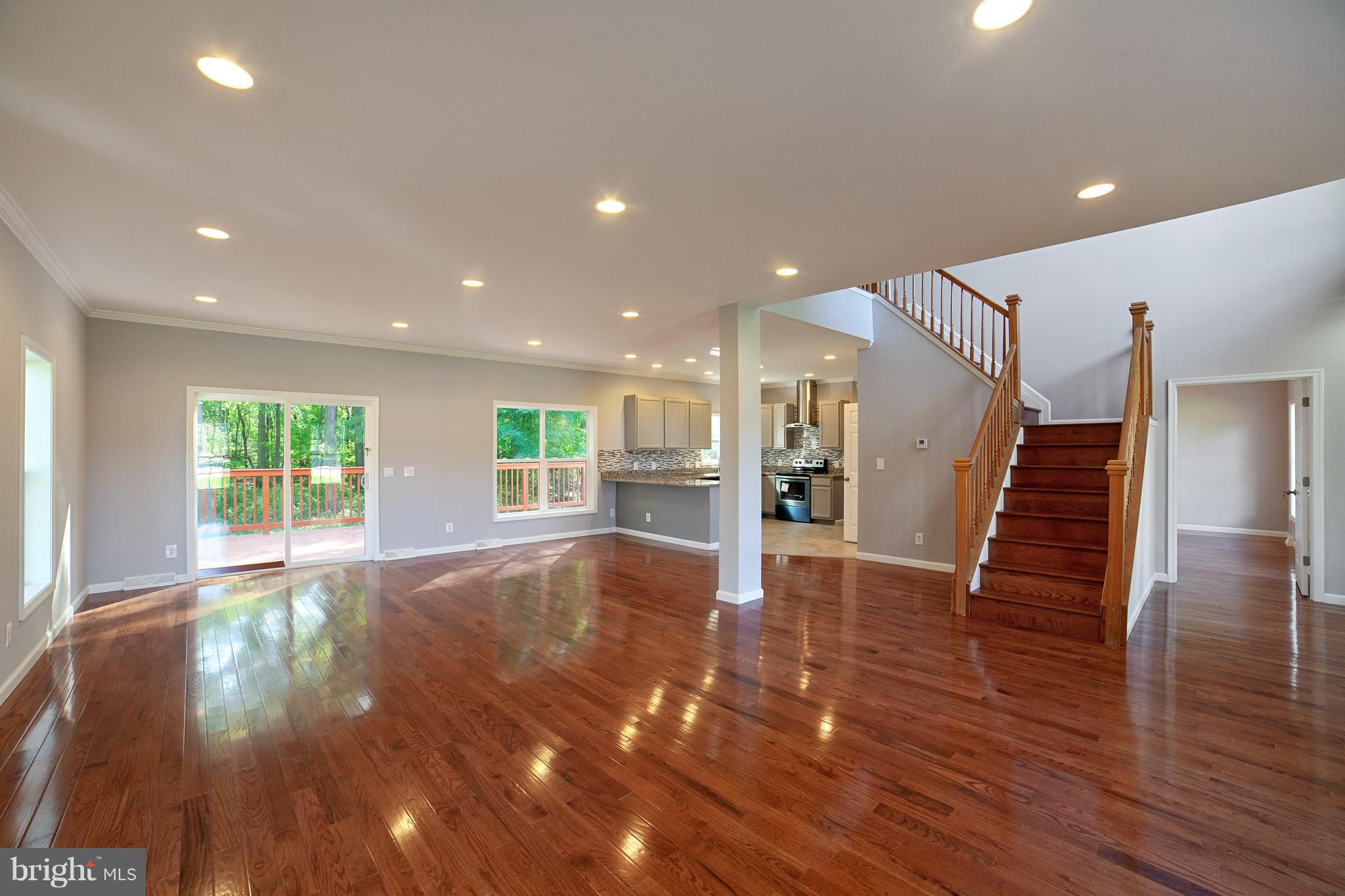 320 W Road Baltimore, MD 21221 - Photo 14 of 30 a view of an empty room with wooden floor and windows