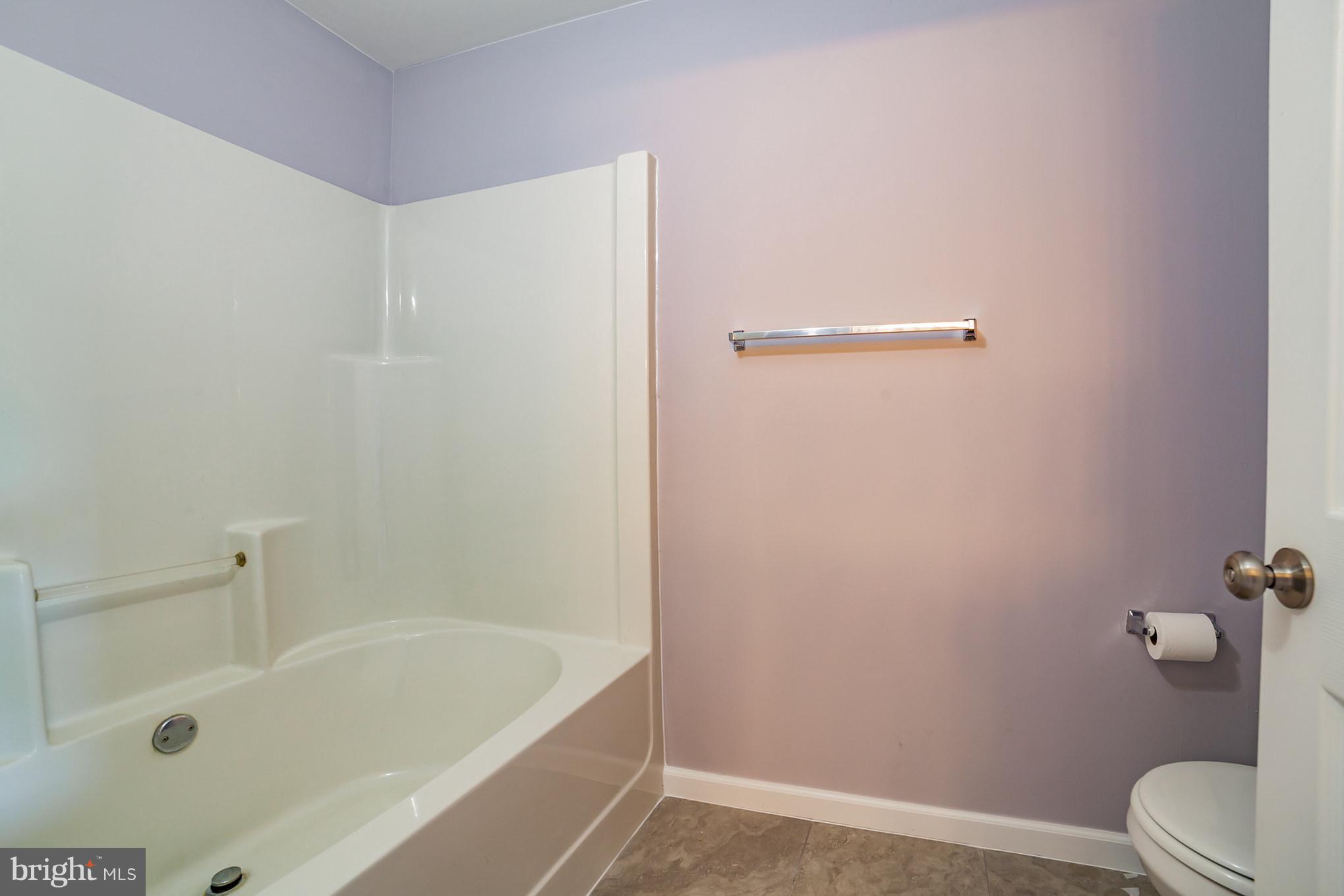 320 W Road Baltimore, MD 21221 - Photo 17 of 30 a bathroom with a tub and toilet