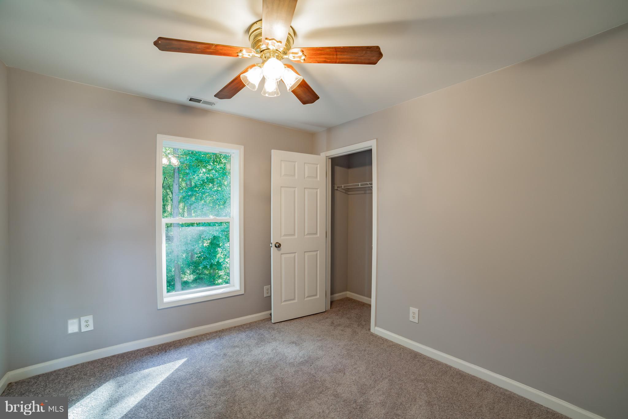320 W Road Baltimore, MD 21221 - Photo 18 of 30 an empty room with windows and fan
