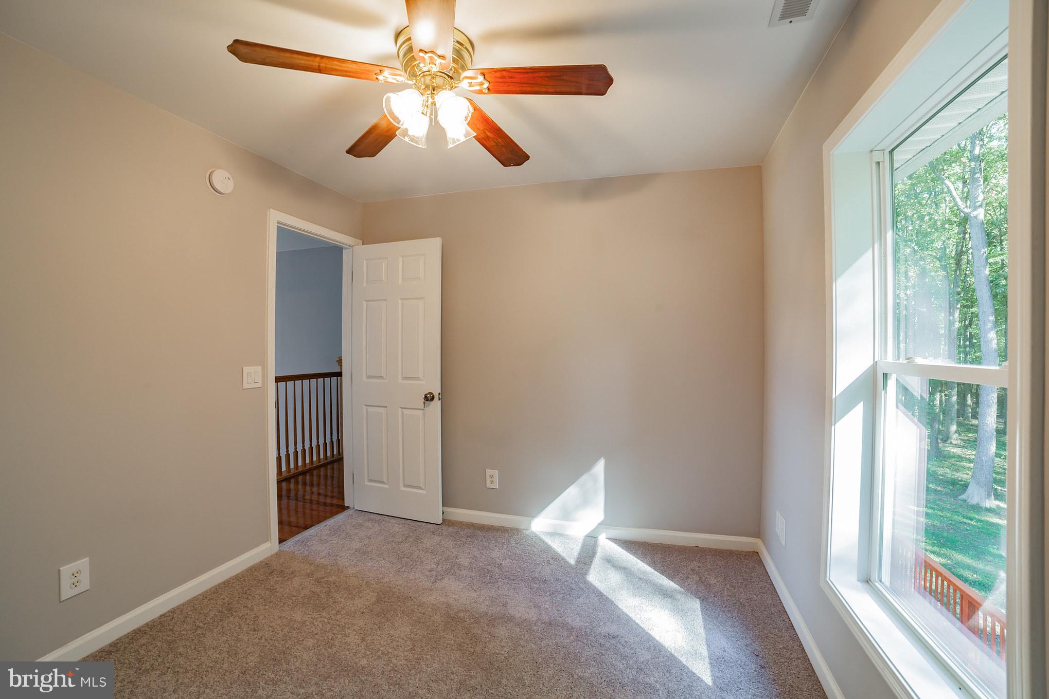 320 W Road Baltimore, MD 21221 - Photo 19 of 30 a view of a livingroom with a ceiling fan and window