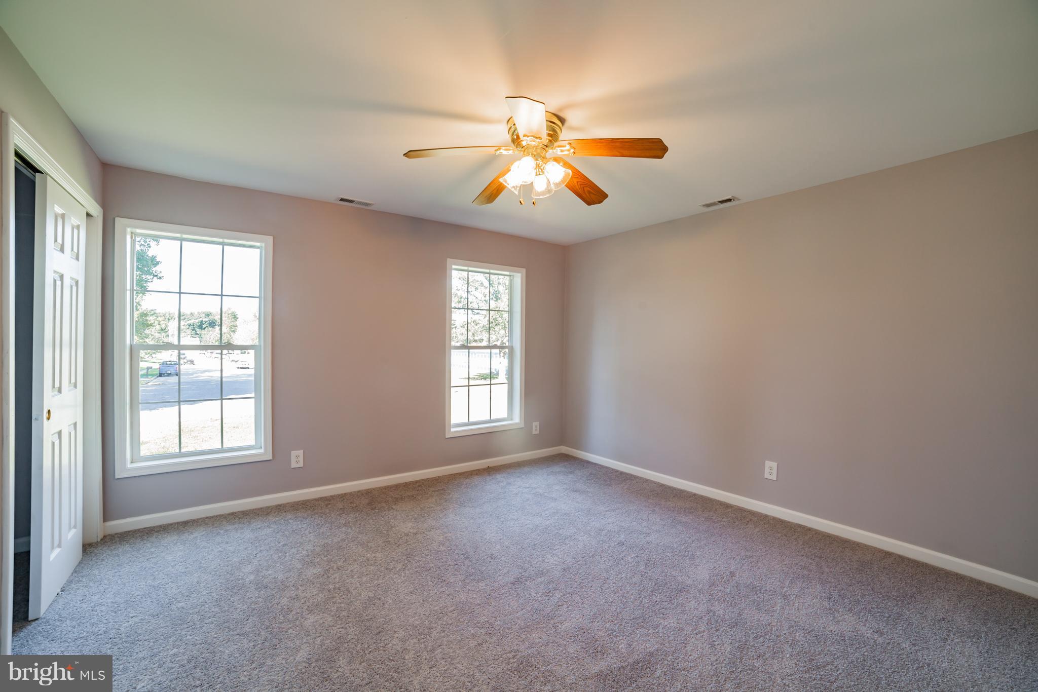 320 W Road Baltimore, MD 21221 - Photo 22 of 30 an empty room with windows and fan
