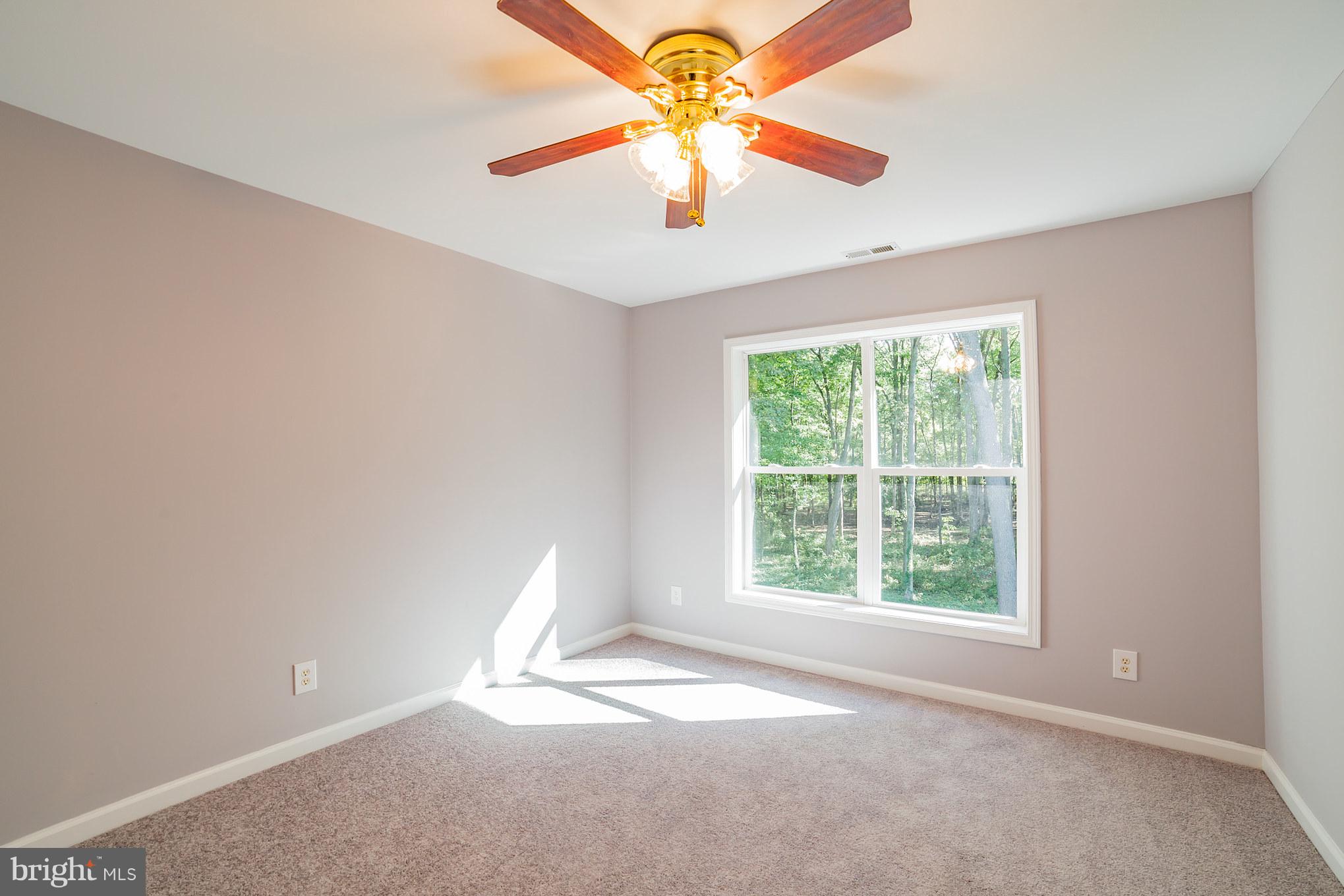 320 W Road Baltimore, MD 21221 - Photo 24 of 30 an empty room with a window and a fan