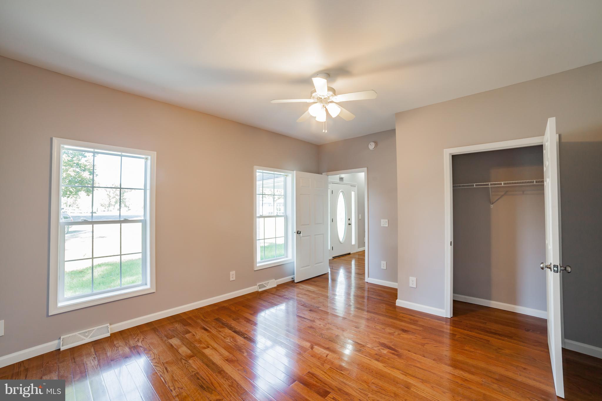 320 W Road Baltimore, MD 21221 - Photo 8 of 30 a view of an empty room with a window and wooden floor