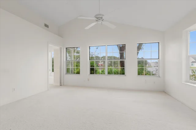 a kitchen with cabinets and window