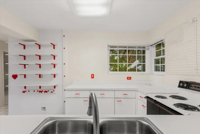 a view of a room with wooden fence