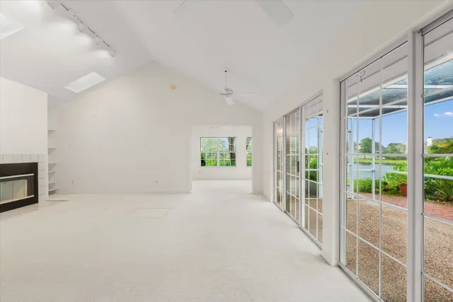 a view of an empty room with windows