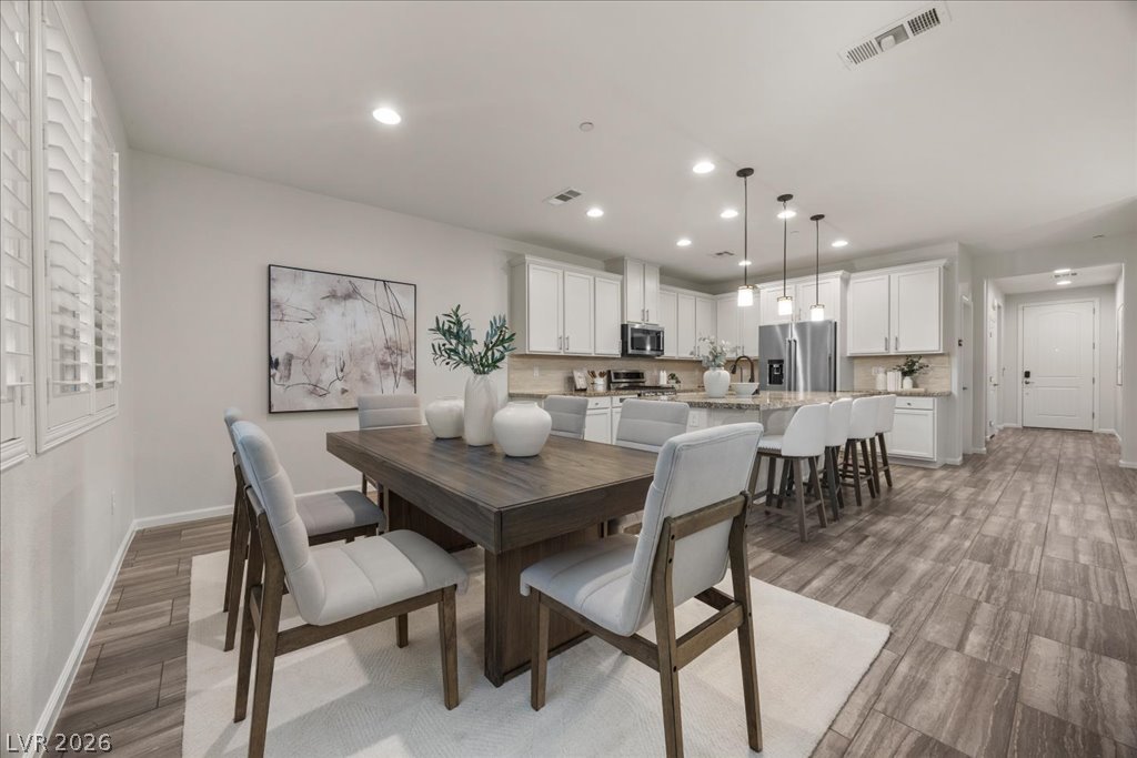 2572 Sable Ridge Street Henderson, NV 89044 - Photo 4 of 83 Plenty of Dining space all within the area of the kitchen & Living room too!