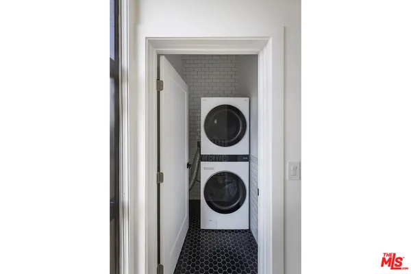 a view of a hallway with washer and dryer
