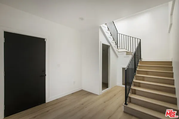 a view of entryway with wooden floor