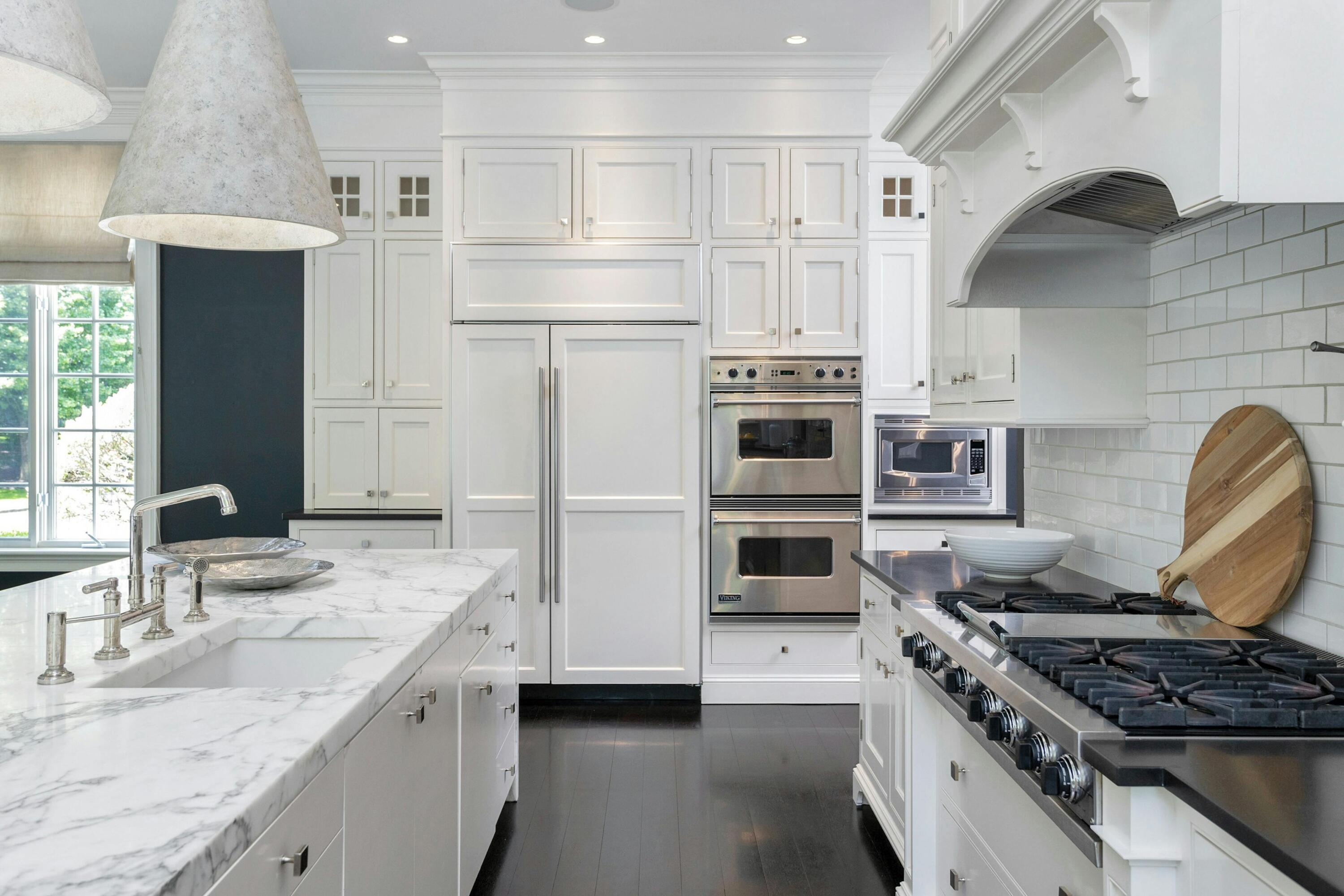 378 Brookside Road Darien, CT 06820 - Photo 11 of 40 a kitchen with stainless steel appliances granite countertop a stove and a refrigerator