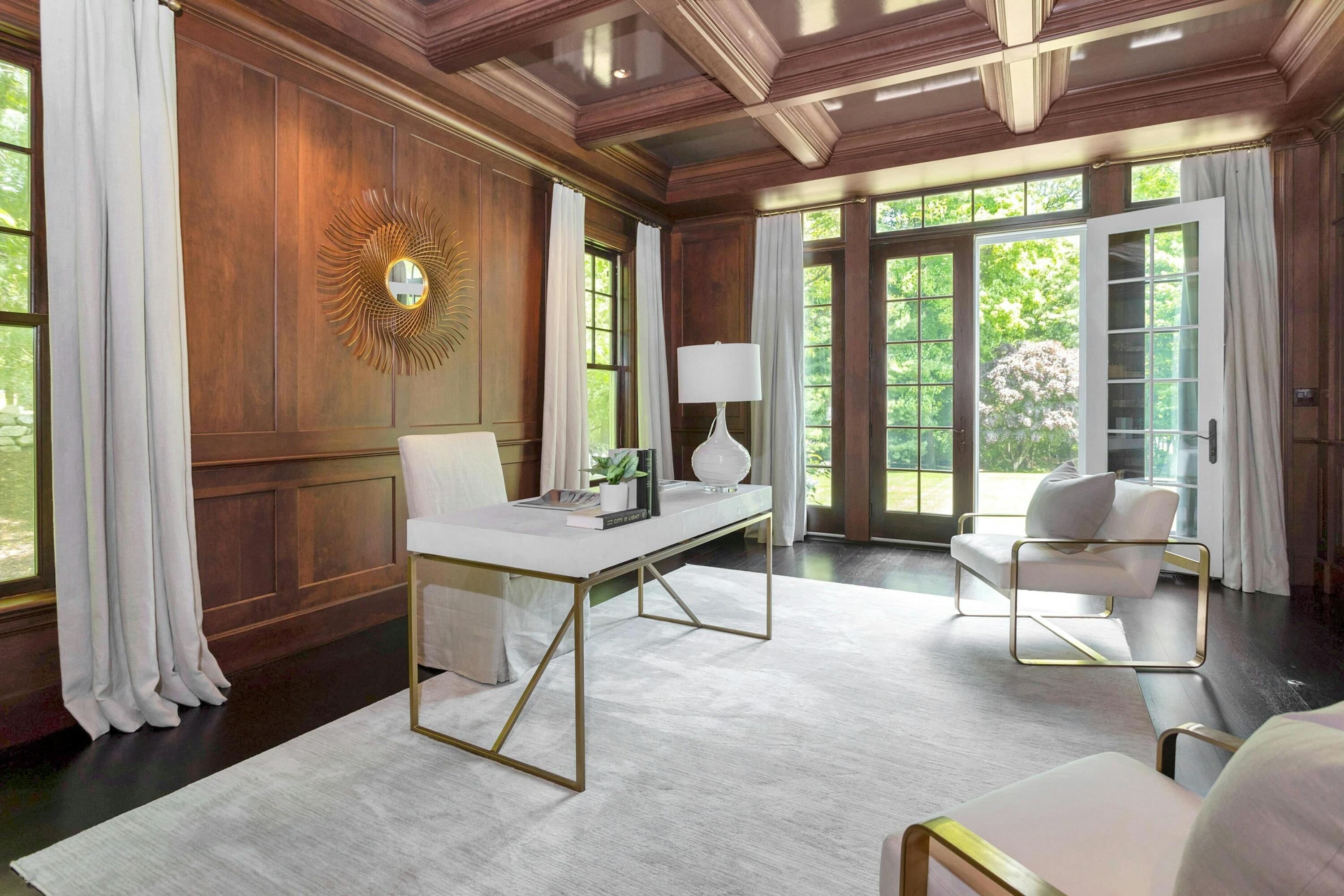 378 Brookside Road Darien, CT 06820 - Photo 20 of 40 a view of a livingroom with furniture and a potted plant