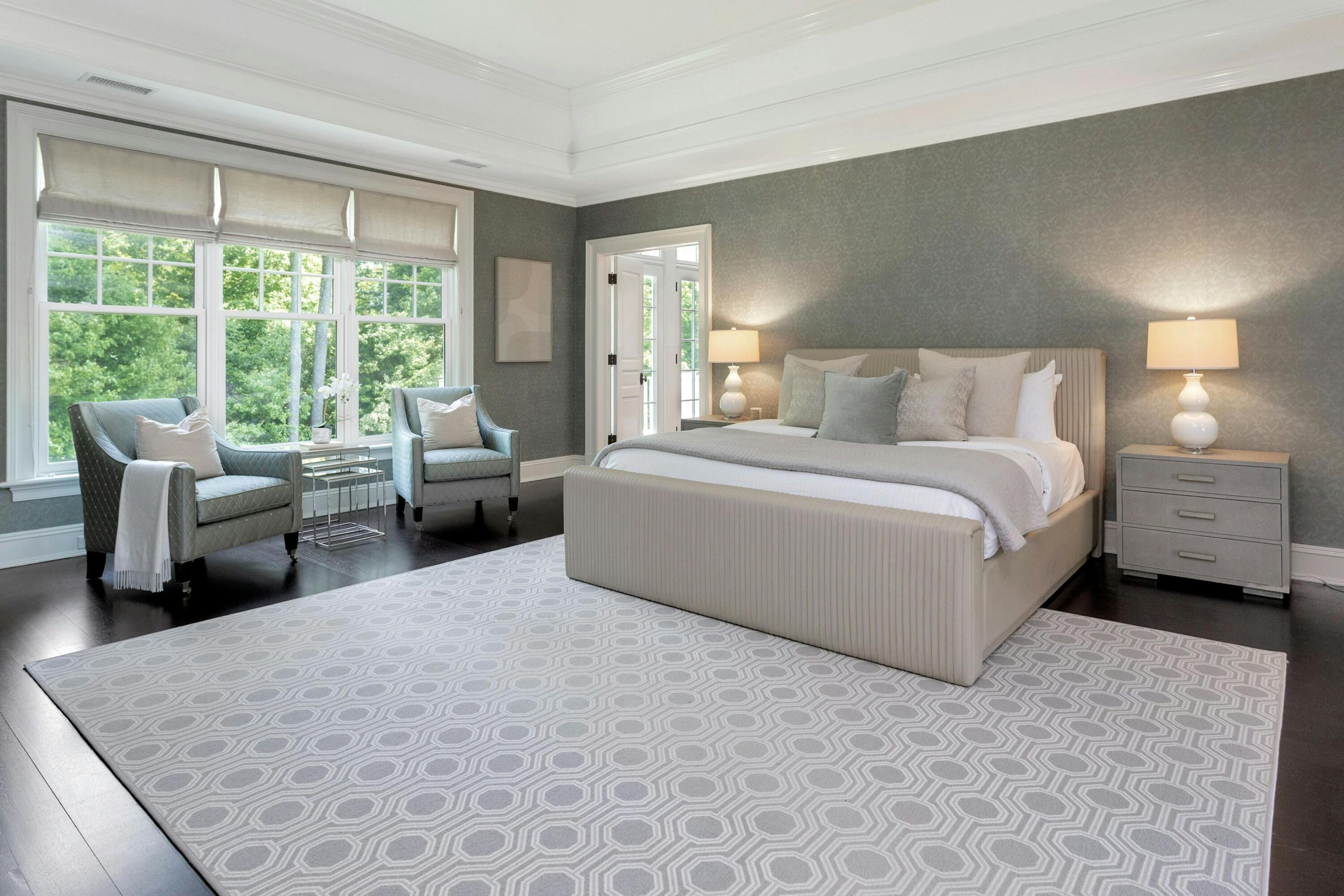 378 Brookside Road Darien, CT 06820 - Photo 23 of 40 a spacious bedroom with a bed and a couch