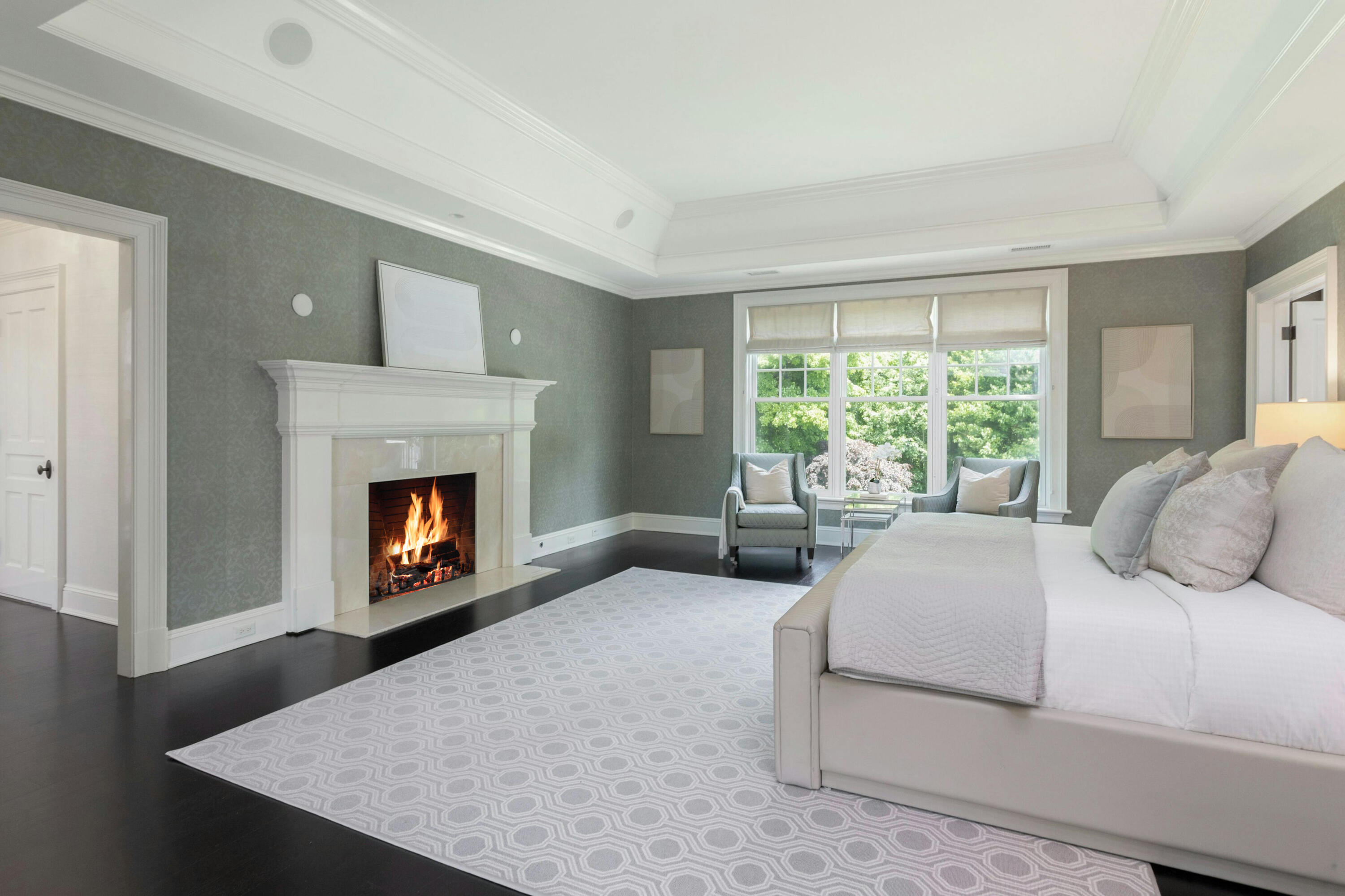 378 Brookside Road Darien, CT 06820 - Photo 24 of 40 a bedroom with a bed and a fireplace